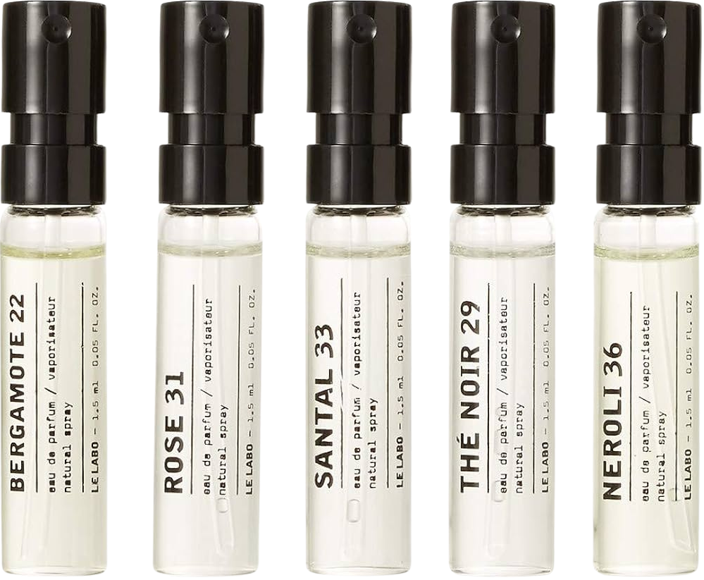 Five Le Labo perfume sample vials with black caps.